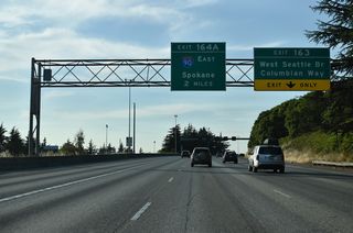 Forthcoming Exit 163 connects with Columbian Way east to South Seattle and the West Seattle Bridge to Riverside and Youngstown. Signed as Business Loop I-5, Exit 164 A joins I-5 north with Interstate 90 east across the Mercer Island Floating Bridge to Bellevue.
