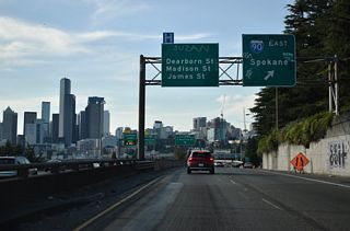The exit for Interstate 90 east to Mercer Island, Bellevue, and Issaquah part ways from the c/d roadway along I-5 north. Interstate 90 meets I-405 at Exit 10 and I-82 at Exit 110. Spokane lies 275 miles to the east.