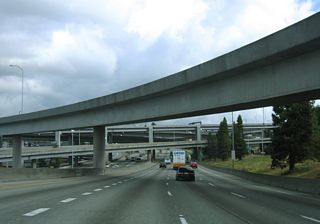 Traveling through the exchange with Interstate 90 on I-5 north. I-90 is double-decked between 6th Avenue S and 12th Avenue S.