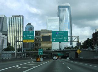 Exit 165 parts ways with Interstate 5 north for Seneca Street. Seneca Street flows west from First Hill to 1st Avenue across the central business district.