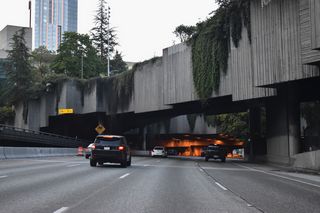 Interstate 5 emerges from the Central Freeway Park tunnel by the University Street entrance ramp and 8th Avenue mini tunnel.