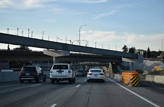 $68 million in construction from August 2021 to May 2025 built a dedicated flyover for HOV-3 traffic between the I-5 Express Lanes and SR 520 (WSDOT, 2025).