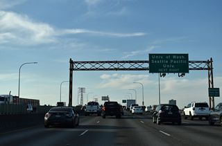 I-5 crosses the Lake Washington Ship Canal between Lake Union and Portage Bay. Interests to Woodland Park Zoo and Seattle Pacific University are directed onto NE 50th Street west toward Fremont.