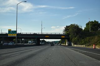 The Express Lanes flyover for SR 522 (Lake City Way) departs in 0.9 miles near Green Lake.