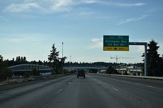 The three quarter cloverleaf interchange at Exit 173 for Northgate Way utilizes connections with 1st Avenue NE and Corliss Avenue NE to the west. Exit 173 to Meridian Avenue south leads to North Seattle Community College.
