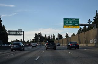 Shifting northeast, Interstate 5 advances to the half diamond interchange (Exit 174) with NE 130th Street west and Roosevelt Way east.