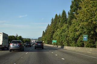 Interstate 5 bends northeast through Cedar Valley ahead of the half diamond interchange (Exit 181 A) with 44th Avenue W.