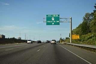 Exit 181 B ties into the intersection of Poplar Way and Alderwood Mall Parkway south of SR 524. Alderwood Parkway arcs northeast from Interstate 5 to Alderwood Mall and SR 525. Poplar Way meanders south to Brier Road and the city of Brier.