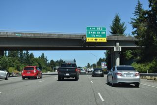 The entrance ramp from Interstate 405 north forms an auxiliary lane to Exit 183 for 164th Street SW.