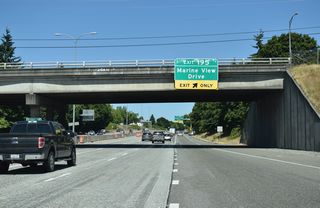 Interstate 5 travels below grade from U.S. 2 to the half diamond interchange (Exit 195) with Marine View Drive and E Grand Avenue. Previous overheads for Exit 195 referenced the Port of Everett.