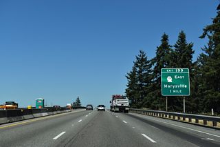 The first of four exits for the city of Marysville joins Interstate 5 with SR 528 (4th Street) at Marine Drive NE.