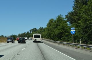 Continuing northwest from Pilchuck Creek, Interstate 5 rises 200 feet in elevation  to SR 532 / Stanwood Bryant Road.