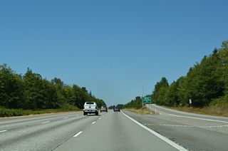 A northbound weigh station operates along Interstate 5 at mile marker 214.