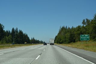 Starbird Road converges with Interstate 5 at a diamond interchange (Exit 218) east of Milltown.