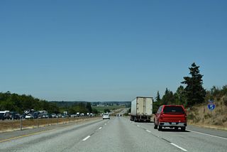 North from Exit 218, Interstate 5 lowers onto the coastal plain east of Skagit Bay.