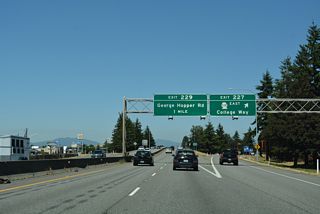Exit 227 descends from Interstate 5 north to College Way and the eastbound beginning of SR 538. Measuring 3.61 miles in length, SR 538 follows College Way to   Skagit Valley College and SR 9 at Baker Heights.