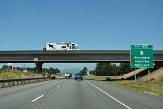 The second exit in Burlington joins Interstate 5 with SR 20 (Avon Cutoff / North Cascades Highway). SR 20 represents the second route to Island County, leading west to the Swinomish Indian Reservation and south across Deception Pass onto Whidbey Island.