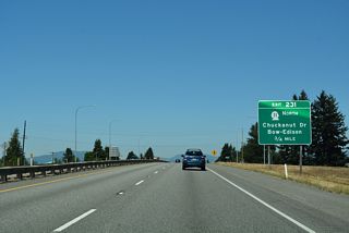 Curving northeast along the Burlington city line, the succeeding exit is with SR 11, a 21.30 mile long loop west to Bellingham Bay and Bellingham. SR 11 returns to I-5 at Exit 250.