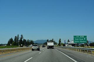A selection of motorist services lines adjacent Old Highway 99 N at the diamond interchange (Exit 232) with Cook Road.