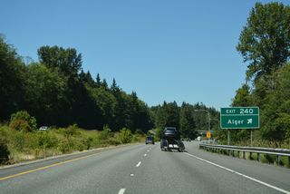 Lake Samish Road turns north from Exit 240 to W Lake Samish Drive and Lake Samish in Whatcom County. Alger Cain Lake Road extends east from Lake Samish Road and Alger to Glenhaven and Lake Whatcom.