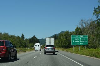 Nulle Road arcs west from Pacific Highway (old U.S. 99) to the diamond interchange at Exit 242.