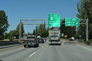 Exit 254 leaves Interstate 5 north at Whatcom Creek for Iowa Street at Moore Street. Iowa Street constitutes a commercial arterial east to Woburn Street and west to the five point intersection with State and James Streets. State Street provides a second route to Downtown Bellingham.