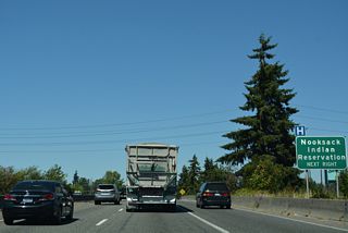 SR 542 (Sunset Drive) runs 9.98 miles east from the parclo interchange at Exit 255 to SR 9 at Nugents Corner, west of the Nooksack Indian Reservation.