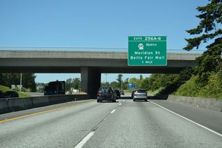 Curving west, Exits 256 A/B joins Interstate 5 next with SR 539 north at Meridian Street (Old U.S. 99 Alternate) and Bellis Fair Parkway at Bellis Fair Mall.