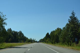 The reassurance marker for Interstate 5 north precedes the Loomis Trail Road over crossing.