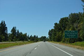 The last three exits from Interstate 5 north fall within the city of Blaine. First is the wye interchange (Exit 274) to Peace Portal Drive (old U.S. 99) after Dakota Creek.