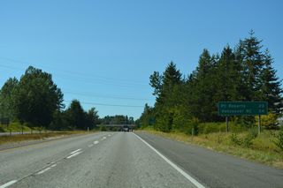 Point Roberts joins Vancouver on the final Interstate 5 distance sign. Point Roberts is unusual in that it is an American community only accessible by land from Canada. B.C. Highway 99 north to B.C. Highway 17 south provides the most direct route to the peninsular town.