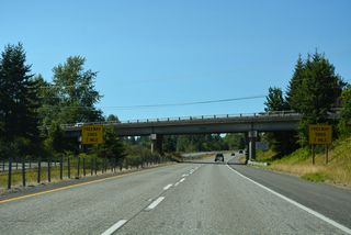Hughes Avenue passes over Interstate 5 one mile south of the freeway end at the Canadian customs facility.
