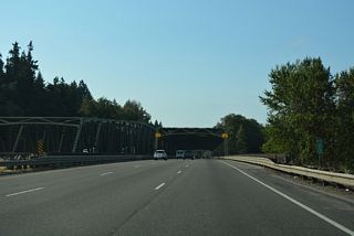 Interstate 5 spans the Lewis River across a pair of truss bridges south of Horseshoe Lake.
