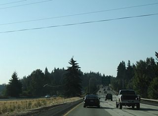 1.5 miles south of the Lewis River, Interstate 5 crosses the Lewis River East Fork at Paradise Point. The northbound bridge dates back to 1936 as U.S. 99/830. The non-descript span on I-5 southbound was built in 1969.