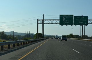 Exit 22 departs Interstate 5 south for Dike Access Road and the Port of Woodland. Exit 21 follows in one mile for Pacific Avenue south to SR 503 (Lewis River Road) east. Old Pacific Highway south from the dogbone interchange with I-5 provides a more direct route to SR 503.