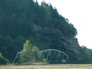 A truss bridge from 1952 takes Meeker Drive (Old U.S. 99/830) across the Kalama east of Interstate 5. This bridge was historically half of the original four lane U.S. 99/830.