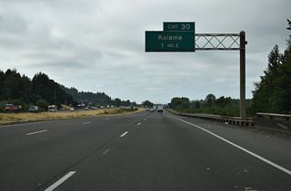 A split diamond interchange (Exit 30) joins Interstate 5 with the Kalama city center. Frontage Roads connect the ramp at Oak Street with Elm Street and the business district.