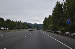 Interstate 5 continues south from Kelso between a BNSF Railroad line and Old Pacific Highway S.