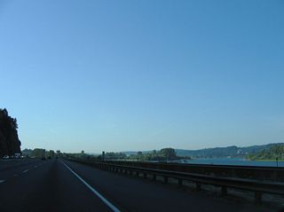 Carrolls Channel along the Columbia River basin flows adjacent to the BNSF Railroad and Interstate 5 southbound roadway. This view looks at the waterway from near Carrolls Bluff.