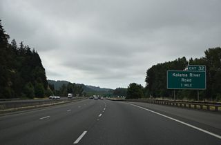 Kalama River Road follows the Kalama River east from the Columbia River and Exit 32 into the Cascade Range foothills.