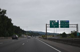 The parclo cloverleaf interchange with SR 432 west also connects to Coweeman Park Drive west to Talley Way. The entrance ramp from Talley Way east to I-5 includes access to a roundabout with Kelso Drive north / Old Pacific Highway (Old U.S. 99/830) south to Vision Acres and Carrolls.
