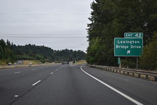 Lexington Bridge Drive stems west from parallel Pacific Avenue into the diamond interchange at Exit 42. West of the Cowlitz River, Lexington Drive intersects SR 411 (Westside Highway) across from Sparks Drive. SR 411 runs south from Lexington to Beacon Hill and West Kelso.