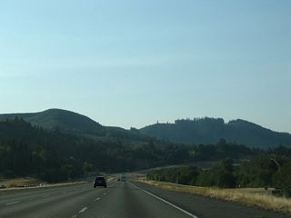 Interstate 5, Pleasant Hill Road (Old U.S. 99) and a BNSF Railroad bend southwest toward Pleasant Hill from Business Loop I-5 (Huntington Avenue).