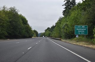 Huntington Avenue (Old U.S. 99) returns to Interstate 5 at a diamond interchange (Exit 48) on the south side of Castle Rock. Huntington Avenue west of I-5 is considered Business Loop I-5, but signage only appears at the south end interchange.