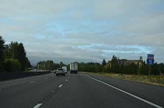 Interstate 5 converges with the Cowlitz River again after the diamond interchange (Exit 52) with Barnes Drive.