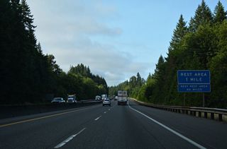 I-5 south expands to three overall lanes from the Lewis County line to Interstate 205 at Exit 7. The Toutle River Rest Areas line both sides of the freeway west of the Wilkes Hills.