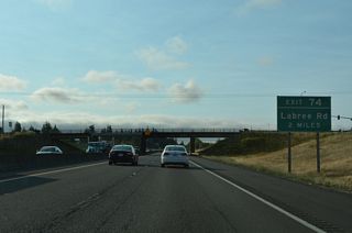 A diamond interchange (Exit 74) opened at LaBree Road on June 2, 2009 as part of a project expanding Interstate 5 to six overall lanes from Exit 74 south to Exit 72 / Rush Road.