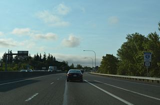 The ensuing stretch of I-5/U.S. 12 south from Chehalis separates agricultural areas to the south with a large industrial park to the east.