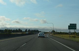 13th Street leads northeast from Exit 76 to Market Boulevard (old U.S. 99) and south as Rice Road to Stan Hedwall Park.