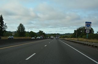 Southbound I-5/U.S. 12 vacate the city of Centralia and parallel the Chehalis River and flood plain.